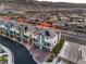 Aerial view of modern homes with solar panels in a well-planned community and mountain backdrop at 6821 Prairie Pearl St, Las Vegas, NV 89148