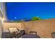 Outdoor backyard seating area, perfect for evening relaxation and gatherings at 6821 Prairie Pearl St, Las Vegas, NV 89148