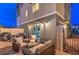 Cozy backyard patio with comfortable seating, gravel floor and easy access to home's sliding door at 6821 Prairie Pearl St, Las Vegas, NV 89148