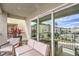 Relaxing covered balcony with comfortable seating, offering views of the surrounding community at 6821 Prairie Pearl St, Las Vegas, NV 89148