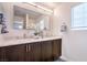 Elegant bathroom featuring double sinks, modern fixtures, and ample counter space at 6821 Prairie Pearl St, Las Vegas, NV 89148