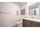 Clean bathroom featuring a vanity with storage, a mirror, and neutral color scheme at 6821 Prairie Pearl St, Las Vegas, NV 89148