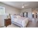 Bright bedroom with a king bed, stylish linens, and a ceiling fan for added comfort at 6821 Prairie Pearl St, Las Vegas, NV 89148