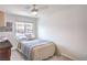 Cozy bedroom with a large window offering a view of the mountain range at 6821 Prairie Pearl St, Las Vegas, NV 89148