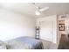 This cozy bedroom features a ceiling fan, closet, and neutral tones creating a serene space at 6821 Prairie Pearl St, Las Vegas, NV 89148