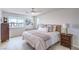 Bright bedroom with a large window, comfortable bed, and modern decor at 6821 Prairie Pearl St, Las Vegas, NV 89148