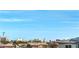 Wide shot of neighborhood and skyline with solar panels on nearby roofs at 6821 Prairie Pearl St, Las Vegas, NV 89148