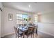 Comfortable dining room boasts natural light and scenic views through a window, perfect for Gathering meals at 6821 Prairie Pearl St, Las Vegas, NV 89148