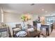 Bright dining area with a stylish table setting, seamlessly connecting to the kitchen and living spaces at 6821 Prairie Pearl St, Las Vegas, NV 89148