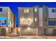 Well-maintained exterior featuring an attached two-car garage and an outdoor balcony at 6821 Prairie Pearl St, Las Vegas, NV 89148