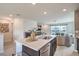 Contemporary kitchen with a large island, modern appliances, and an open layout that flows into the living area at 6821 Prairie Pearl St, Las Vegas, NV 89148
