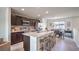 Well-equipped kitchen features stainless steel appliances, ample counter space, and a stylish breakfast bar area at 6821 Prairie Pearl St, Las Vegas, NV 89148