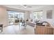 Bright living room features a balcony, large sliding glass doors, and modern furnishings at 6821 Prairie Pearl St, Las Vegas, NV 89148