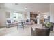 Spacious living room seamlessly connects to the kitchen, offering ample seating and stylish decor throughout at 6821 Prairie Pearl St, Las Vegas, NV 89148
