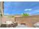 Private patio with stylish seating, a brick wall, and mountain views at 6821 Prairie Pearl St, Las Vegas, NV 89148