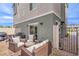 Outdoor patio area features stylish wicker furniture, a grill, and a dining set at 6821 Prairie Pearl St, Las Vegas, NV 89148