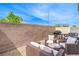 Outdoor patio area features stylish wicker furniture, a grill, and a dining set at 6821 Prairie Pearl St, Las Vegas, NV 89148