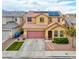 Inviting two-story home featuring a well-manicured lawn, desert landscaping, and a two-car garage at 7129 Dillseed Dr, Las Vegas, NV 89131