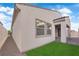 Exterior of home featuring a patch of green grass and low-maintenance rock landscaping at 720 Webber Park St, Henderson, NV 89011