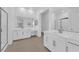 Bathroom features dual vanities, modern mirrors and large glass shower at 720 Webber Park St, Henderson, NV 89011