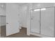 Shower and toilet in the bathroom is separated from main bathroom by glass doors at 720 Webber Park St, Henderson, NV 89011