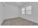 Bedroom with plush carpet and two windows offering natural light at 720 Webber Park St, Henderson, NV 89011