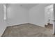 Neutral bedroom featuring plush carpeting, modern windows, and a view into the attached bathroom at 720 Webber Park St, Henderson, NV 89011