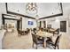 Bright cafe space with round tables, comfortable seating, stylish pendant lights, and tiled flooring at 720 Webber Park St, Henderson, NV 89011