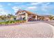Clubhouse exterior with covered entrance, surrounded by well-maintained landscaping at 720 Webber Park St, Henderson, NV 89011
