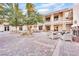 Relaxing outdoor courtyard featuring brick pavers, seating areas, and decorative landscaping between inviting multi-story buildings at 720 Webber Park St, Henderson, NV 89011