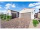 Close-up of a two-car garage and a brick driveway at 720 Webber Park St, Henderson, NV 89011