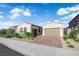 Charming single-story home with a two-car garage and landscaped front yard at 720 Webber Park St, Henderson, NV 89011