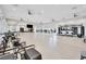Large, bright gym with modern equipment, ceiling fans, and large windows for natural light at 720 Webber Park St, Henderson, NV 89011