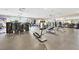 Spacious gym with a variety of modern exercise equipment, large mirrors, and abundant natural light from expansive windows at 720 Webber Park St, Henderson, NV 89011