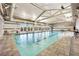 Large indoor pool with clear water, lounge chairs, and large windows for natural light at 720 Webber Park St, Henderson, NV 89011