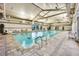 Bright indoor pool with clear water, accessible entry, and large windows for natural light at 720 Webber Park St, Henderson, NV 89011