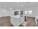 Bright kitchen featuring a spacious island and a seamless transition to the living area at 720 Webber Park St, Henderson, NV 89011