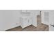 Laundry area features white cabinets, countertop, and modern fixtures at 720 Webber Park St, Henderson, NV 89011