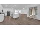 Open living area featuring a kitchen island and stainless steel appliances at 720 Webber Park St, Henderson, NV 89011