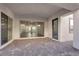 Covered patio with brick pavers, sliding glass doors, and access to the home's interior at 720 Webber Park St, Henderson, NV 89011