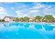 Large community pool featuring crystal clear water, shaded seating, and landscaped surroundings for relaxation at 720 Webber Park St, Henderson, NV 89011