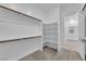 Spacious walk-in closet with built-in shelves and racks provides ample storage space and organization at 720 Webber Park St, Henderson, NV 89011
