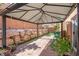 Backyard featuring a patio cover with pavers and low-maintenance rock landscaping at 7641 Lani Dawn St, Las Vegas, NV 89149