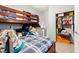 bedroom featuring a bunk bed, closet, and cozy decor for a playful atmosphere at 7641 Lani Dawn St, Las Vegas, NV 89149