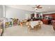 Large dining and living space, offering an open floor plan and tiled flooring at 7641 Lani Dawn St, Las Vegas, NV 89149