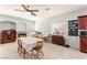 Spacious kitchen and dining area with tile floors, neutral walls, and lots of natural light at 7641 Lani Dawn St, Las Vegas, NV 89149