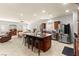 Open-concept kitchen features a large island, stainless steel appliances, and tile flooring at 7641 Lani Dawn St, Las Vegas, NV 89149