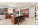 Spacious kitchen with granite countertops, stainless steel appliances, and an island with barstool seating at 7641 Lani Dawn St, Las Vegas, NV 89149