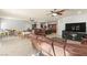 Bright open living room with hardwood cabinets, a ceiling fan, and lots of natural light at 7641 Lani Dawn St, Las Vegas, NV 89149