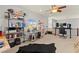 Bright loft area with multiple desks, bookshelves, and comfortable seating, ideal for work or study at 7641 Lani Dawn St, Las Vegas, NV 89149